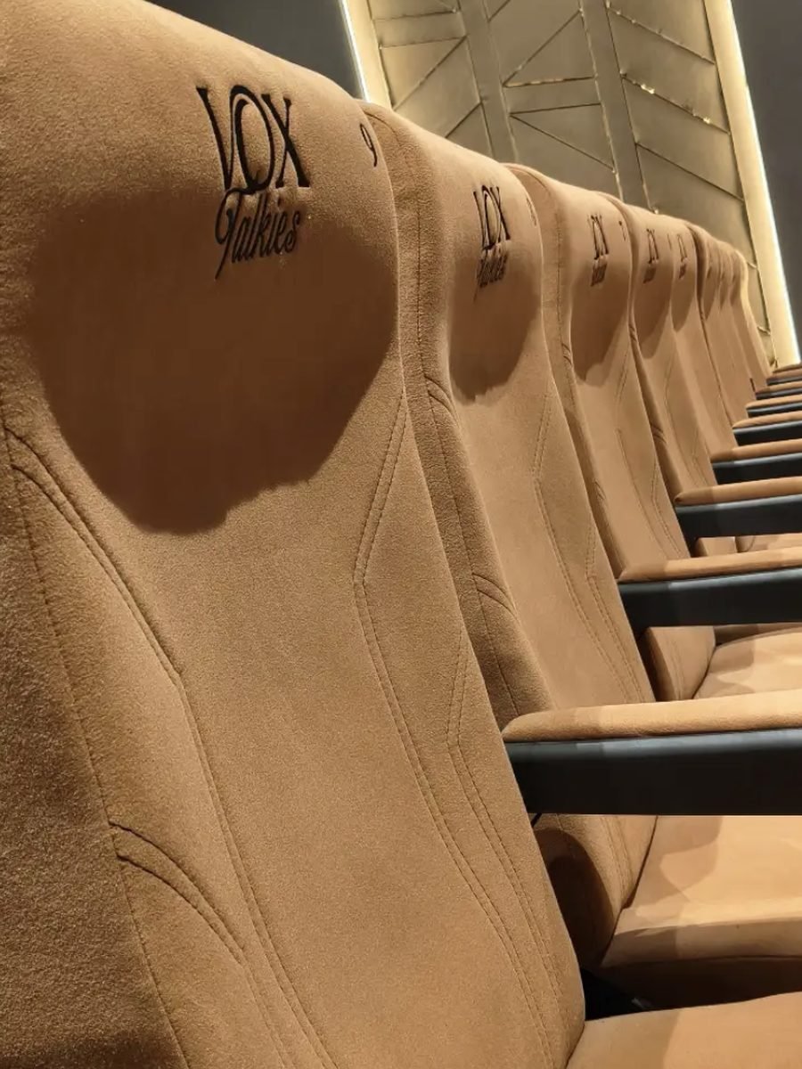 Close detail of an embroidered Vox Talkies recliner headrest